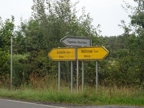 Figure 9. Road sign pointing to the former village of Mühlrose (Miłoraz), destroyed to make way for the expansion of the Nochten open-cast lignite mine. Photo: Giustina Selvelli.